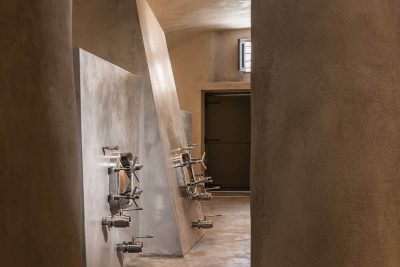 Surrounded by the volcanic slopes around it, the VSV winery does not hurry to be uncovered